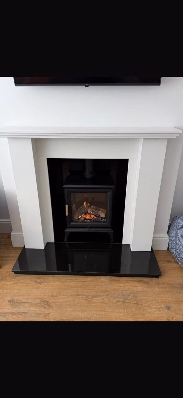 Bespoke marble fireplace with a Ravel 400 gas stove in Appleton, Warrington
