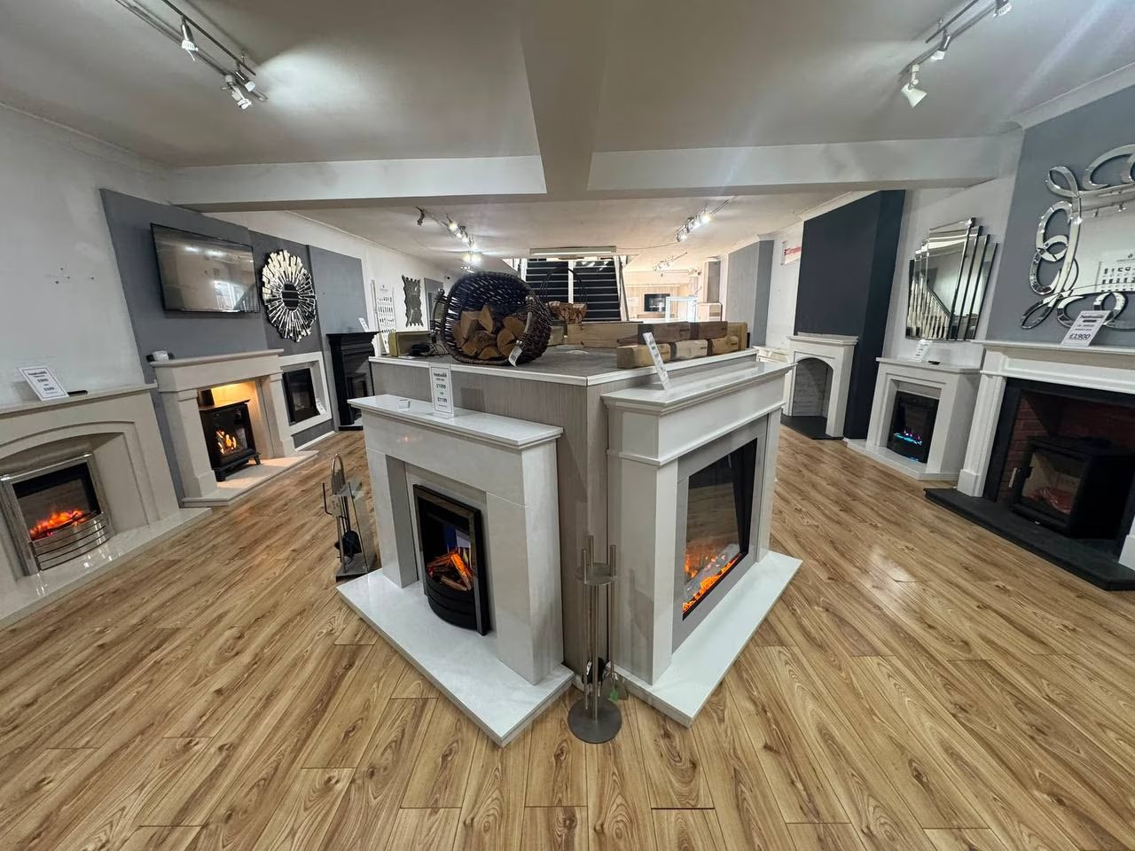 Fireplace and stove displays inside the Heatwave Fireplaces Warrington showroom