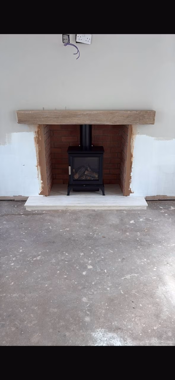 Mere Knutsford Ravel 400 balanced flue gas stove with limestone hearth