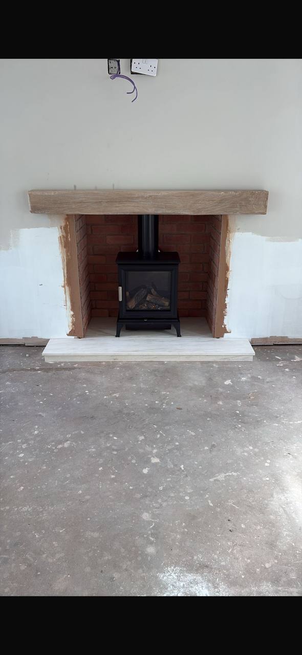 Mere Knutsford Ravel 400 balanced flue gas stove with limestone hearth